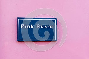 Sign for 'Pink River' engraved on a tile
