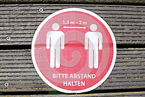 Sign Please keep your distance, minimum distance due to corona virus, Germany, Europe