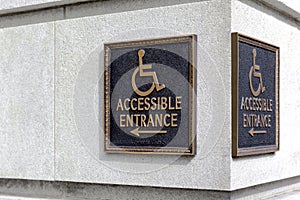 Sign pointer direction motion the wheelchair on the building cor