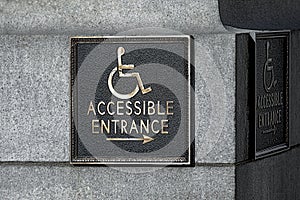 Sign pointer direction motion the wheelchair on the building corne