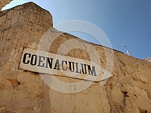 Sign pointing to the abbey of Dormition Church of the Cenacle on mount Zion, Israel.