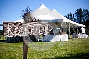 Sign points the way to the wedding tent