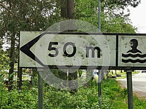 Sign post for beach in Sweden