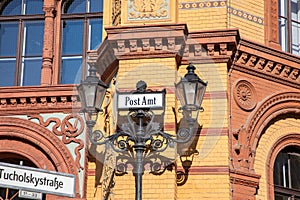 sign Post office building - (Kaiserliches Postfuhramt - on Oranienburger street crossing Tucholsky street in Berlin