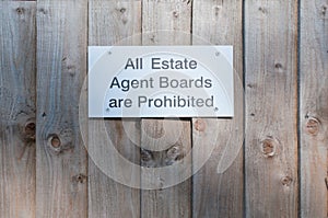 Sign post outside a property 'All Estate Agent Boards Are Prohib