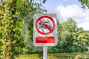 Sign post prohibiting swimming at Lake Echternach