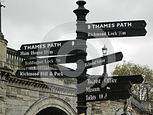 Sign post by Richmond upon Thames Bridge in London