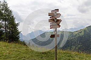 Sign post showing hiking paths in the Dolomites Alps, Italy