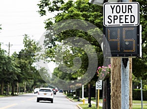 Sign posting your driving speed on local village road photo