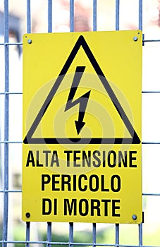 Sign with potentially fatal HIGH VOLTAGE in an industrial site