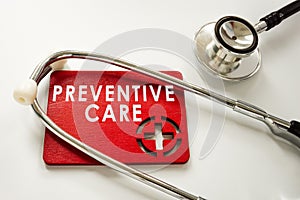 Sign preventive health care and medical stethoscope. photo