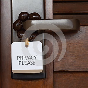 Sign Privacy Please at closed tropical hotel door