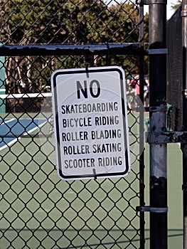 Sign prohibiting bicycles scooter roller blades and skateboards