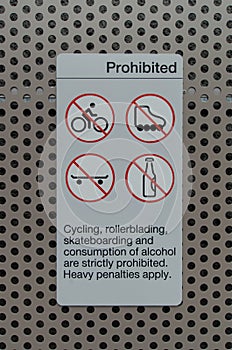 Sign prohibiting cycling, skateboarding photo
