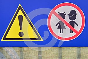 A sign prohibiting the entry of children on the fence near the construction site - Moscow, Russia, October 17, 2021