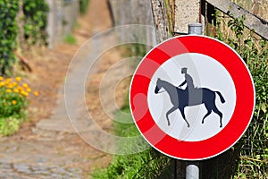 Sign prohibiting horseback riding