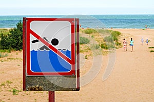 Sign prohibiting swimming in sea. Sign no swim.