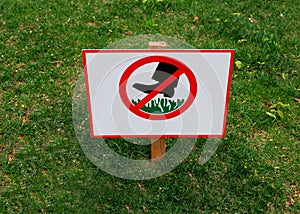 A sign prohibiting walking on the lawn