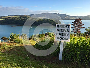 Sign promoting tourism in Mangonui Harbour, Northland, New Zealand photo