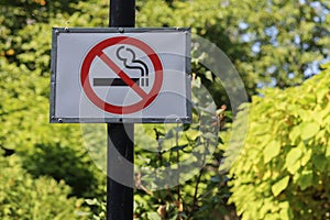 Sign in a public place informing that smoking is prohibited photo
