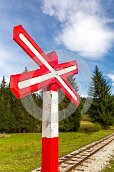 Sign of railroad crossing.
