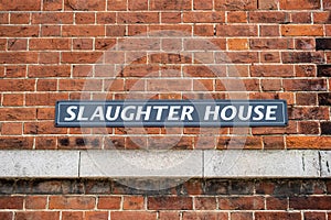 A Sign reading Slaughter house on a brick building photo