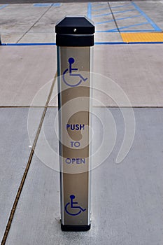 Sign that reads "Push to Open" providing accessibility for individuals with disabilities