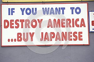 A sign that reads ï¿½If you want to destroy Americaï¿½buy Japaneseï¿½