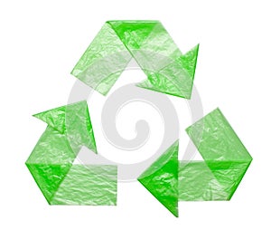 Sign recycling plastic from green bags isolated on a white background. Environmental pollution by disposable bags