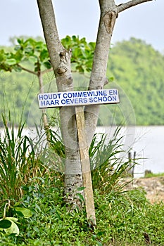 Sign with the request to keep nature clean photo