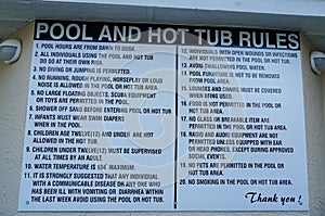 Sign at a resort or homes association pool stating the rules for use of pool and hot tub