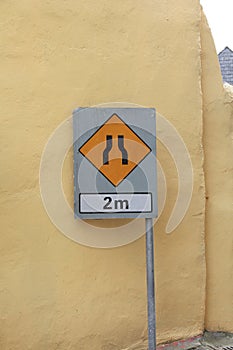 Sign road narrows in two metres photo
