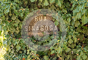 Sign for Rua Sinagoga on narrow cobbled street in Castelo Rodrigo in Portugal