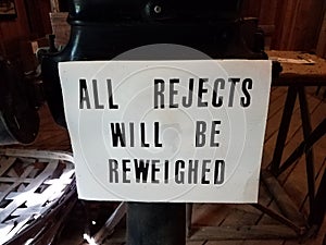 Sign saying all rejects will be reweighted photo