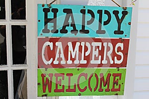 Sign saying happy campers welcome
