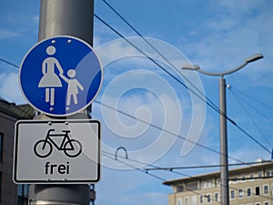 Sign saying sidewalk for pedestrians, bikes allowed``