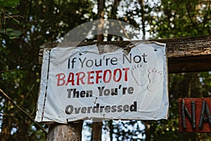 a sign that says if you're not barefoot then you are overdressed