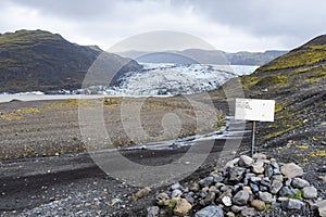 Sign showing how much the Solheimajokull Glacier in Iceland has receded in recent years photo