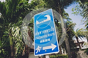 A sign showing a tsunami evacuation route at island in Thailand