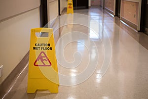 Sign showing warning of caution wet floor in hospital corridor