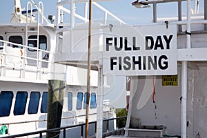 Sign on the side of a charter fishing boat