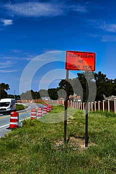 Sign Slow Down Construction ahead warning