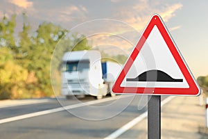 Sign Speed Bump near asphalt road outdoors