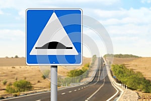 Sign Speed Bump near asphalt road outdoors