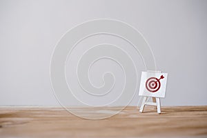 Sign stand with an arrow in the target.Tactics of advertising targeting. advertise campaigns. Goal achievement and Purposefulness photo