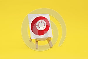 Sign stand on a yellow background. Hit exactly on center. Tactics of advertising targeting. advertise campaigns. Goal Achievement