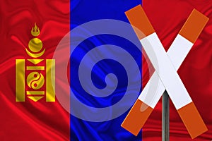 Sign, stop, attention against the background of the silk national flag of Mongolia, the concept of border and customs control,