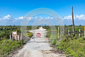 sign stop and private property at an iron gate with fence