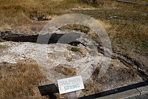 Sign for Sulphide Spring in the Geyser Hill group area in Upper Geyser Basin, in Yellowstone National Park photo