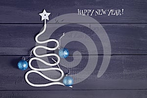 Sign symbol Christmas tree on a wooden background. A copy of space. The idea of a merry new year. Christmas.